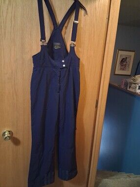vintage pair ski bib overalls by HEAD, .silver-tone metallic buckle clip